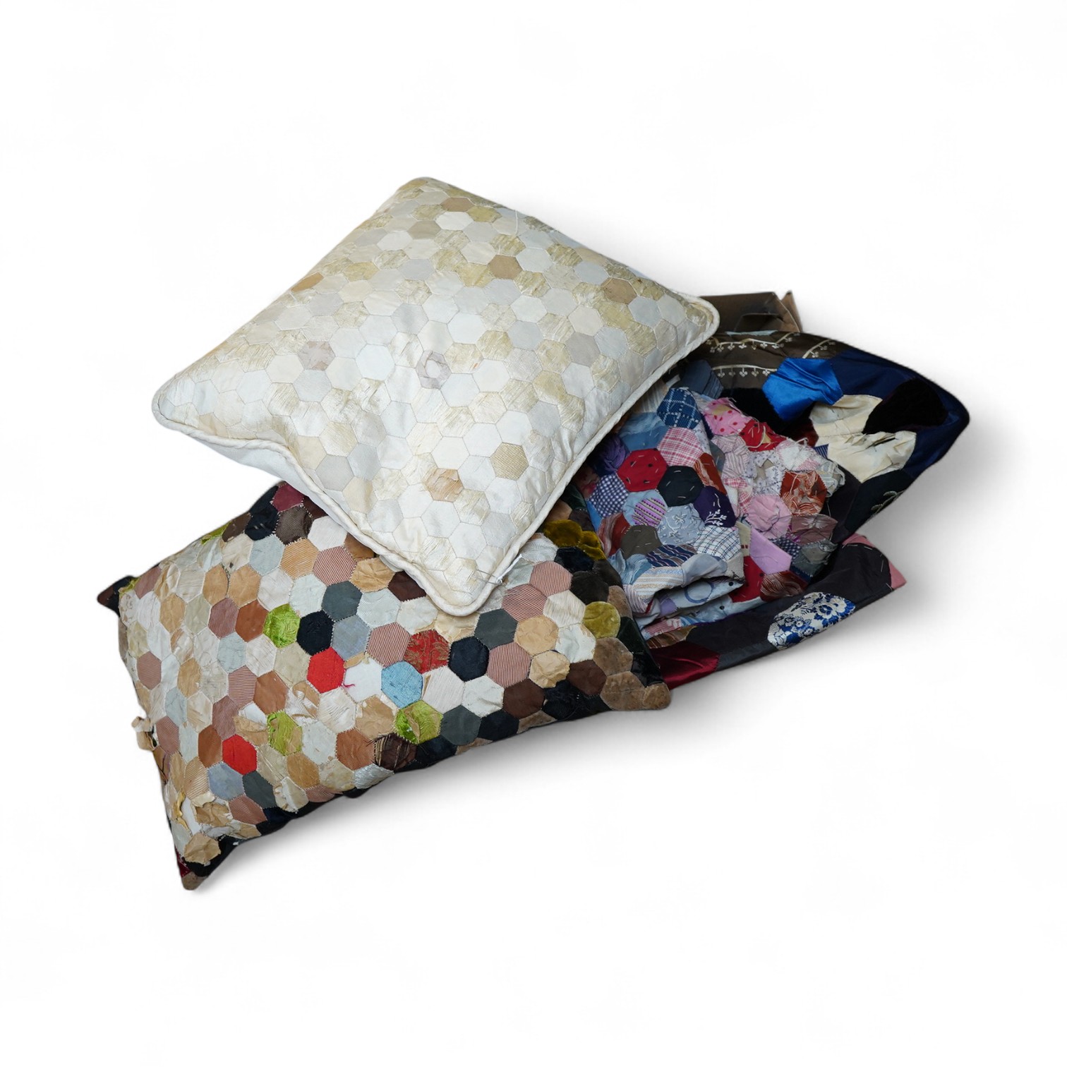 Three various sized 19th century patchwork panels and two patch worked cushions, for using as restoration fabric for larger damaged quilts.
